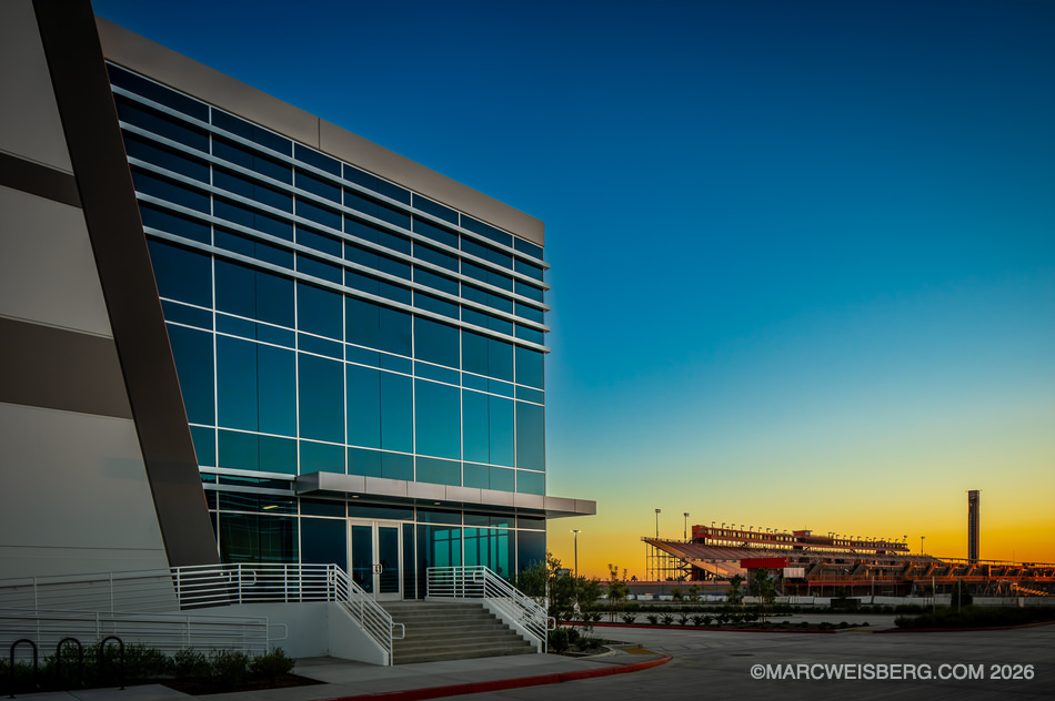 Fontana logistics center at twilight with the former speedway in the background