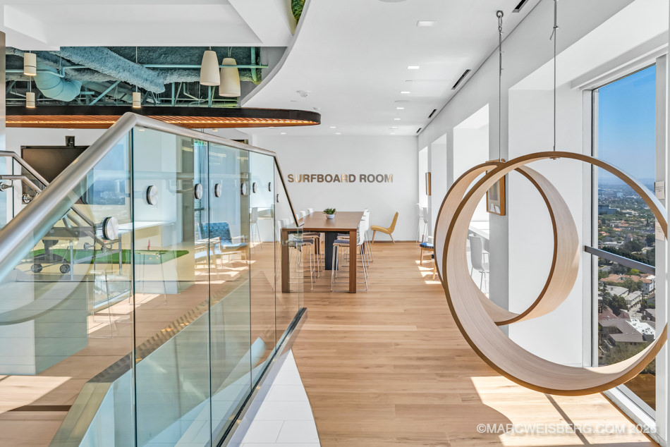 Office floor with glass staircase and city views at Manatt headquarters in Century City