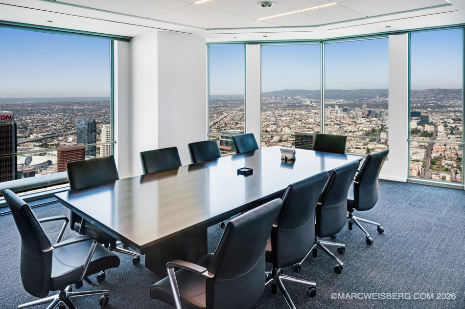 High rise conference room with floor to ceiling windows overlooking Los Angeles